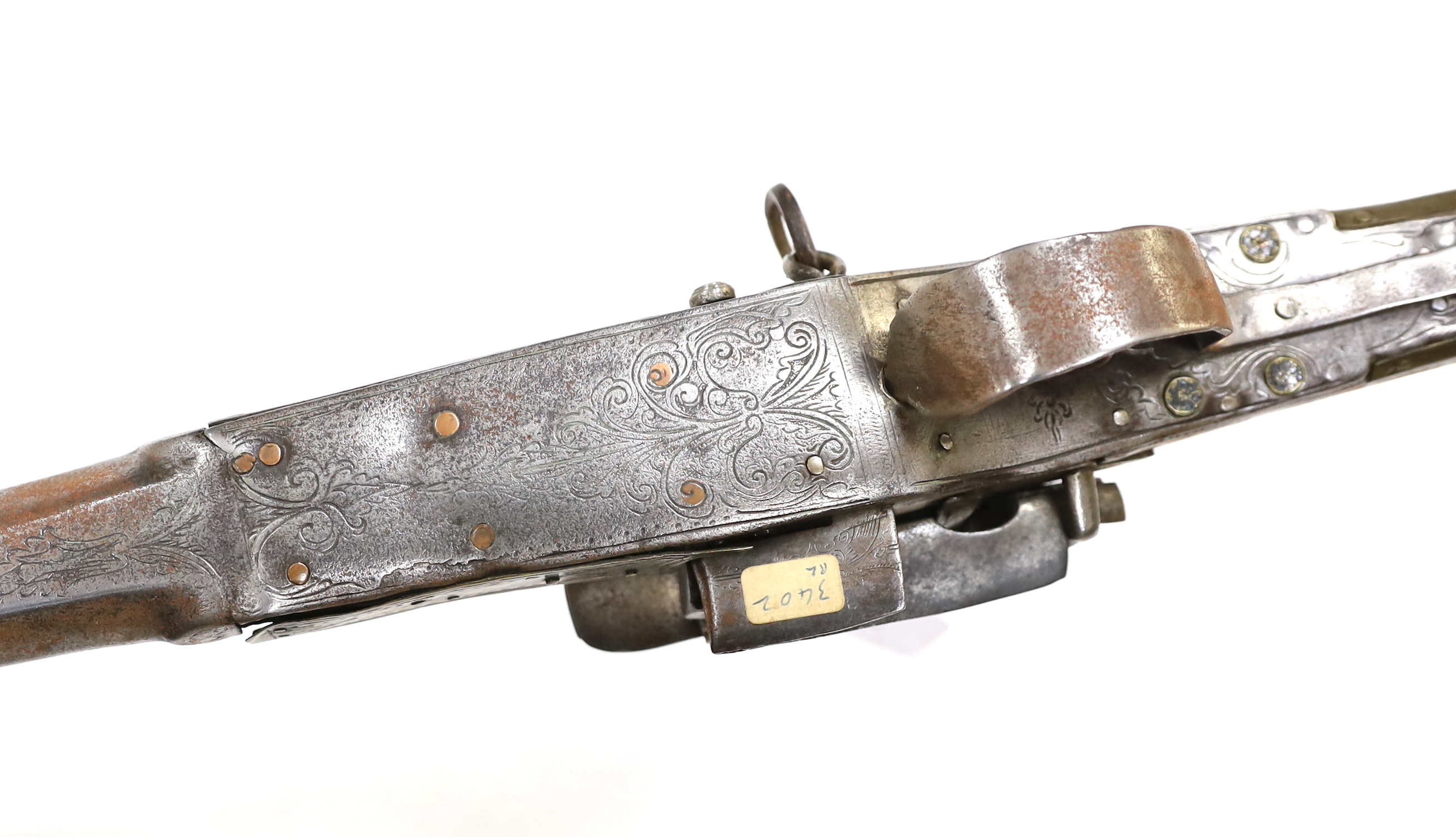 A 19th century Albanian flintlock miquelet lock rifle (Balkan long arm) and a Caucasian style dagger, with niello work scabbard, barrel 122cm (2)